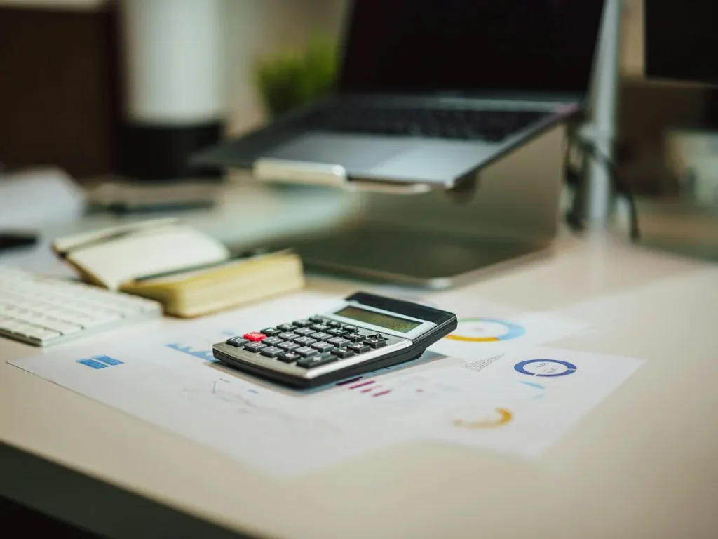Calculator and paperwork for calculating KITAS Bali costs