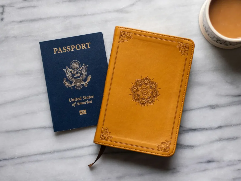 Passport and notebook for a KITAS application by nationality