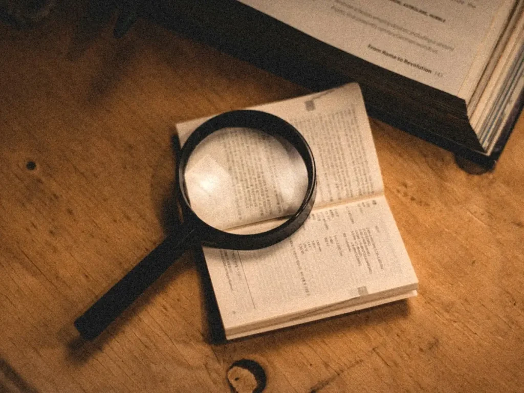 Magnifying glass over documents, choosing a KITAS agent in Bali