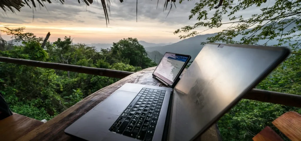 Laptop on a jungle balcony, remote work in Bali
